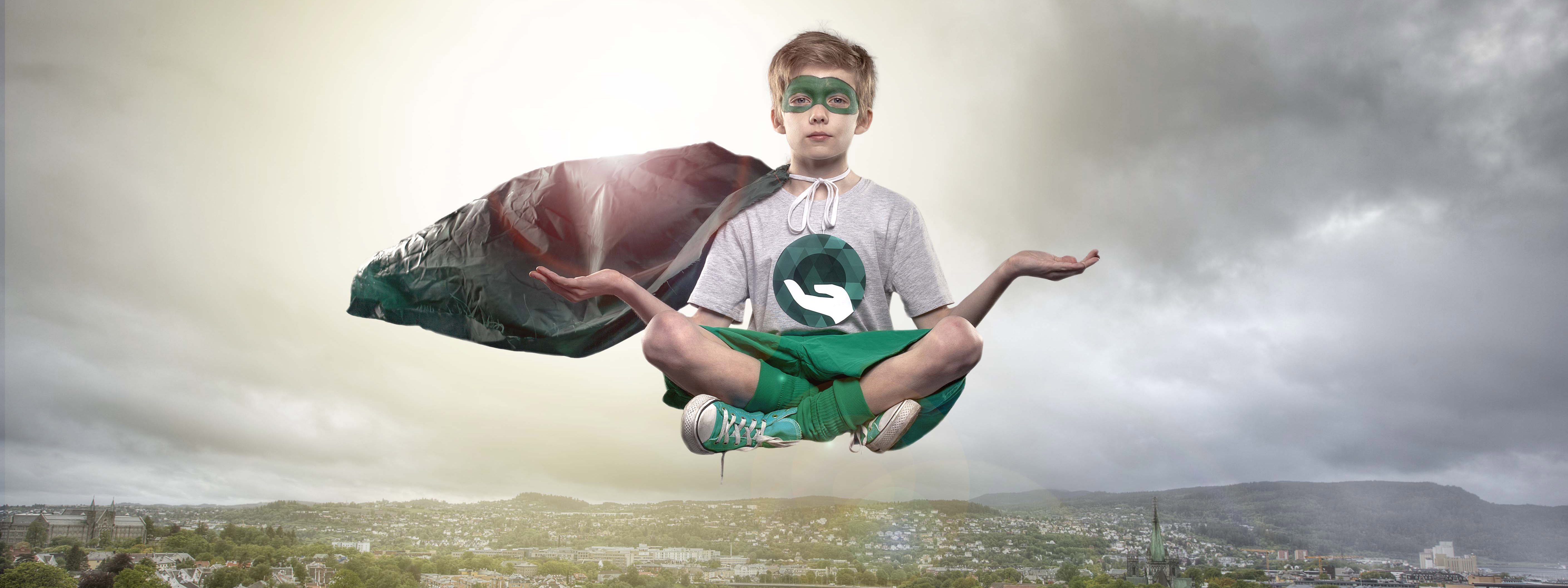 Green superhero over the city. Photo.