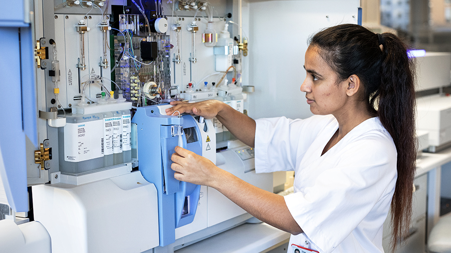 A student using advanced equipment in the lab