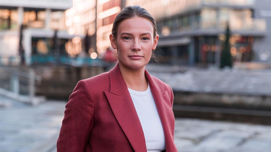 Portrait of Vilde T. Coward. Credit: North Stories, Tobias Fjellheim Portrait of female standing in the street facing the camera.