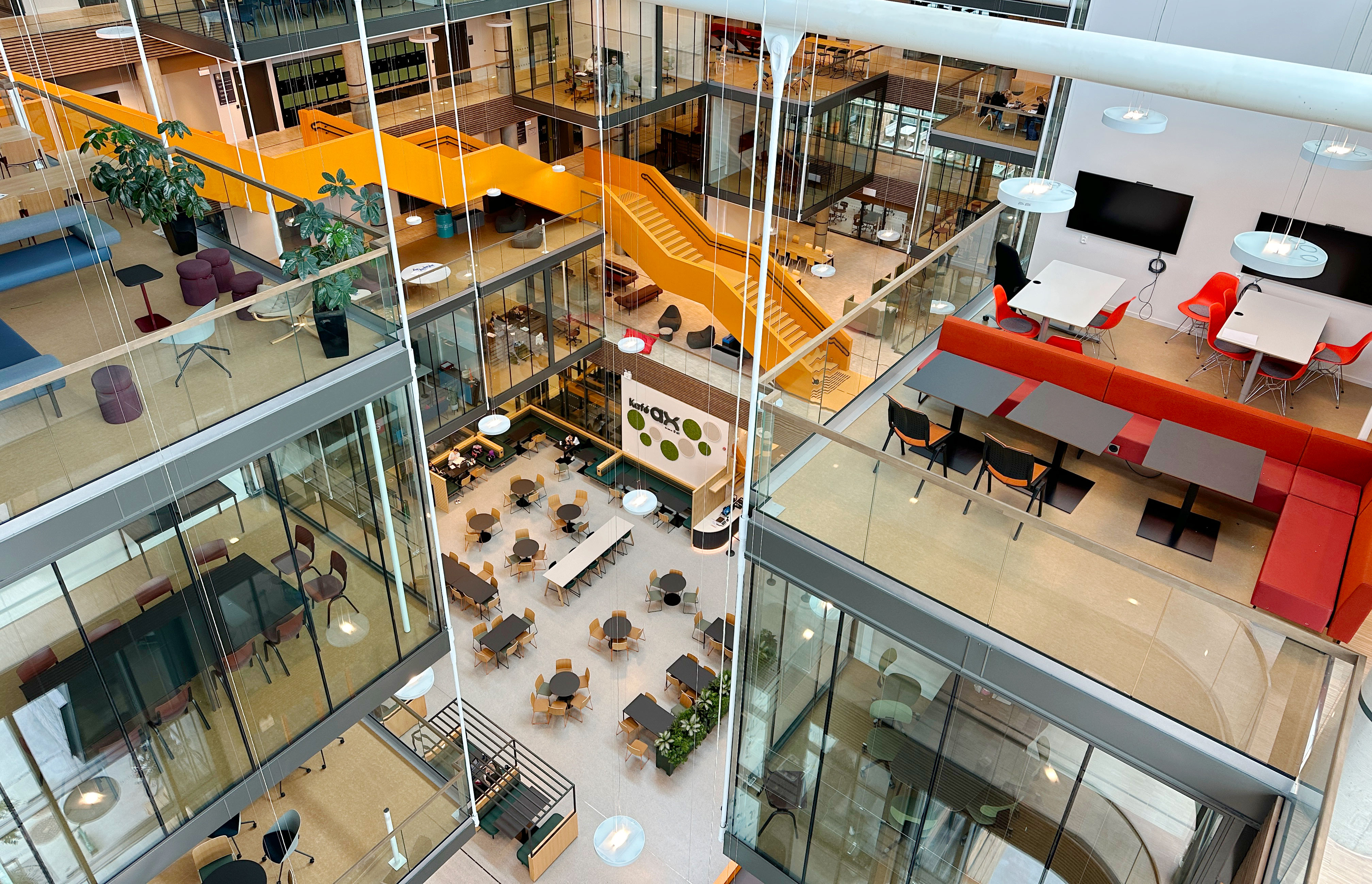 Photo from the sixth floor of Helgasetr. Shows the open floors and the cafeteria on the ground floor.