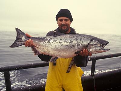 Photo of a man with a large salmon
