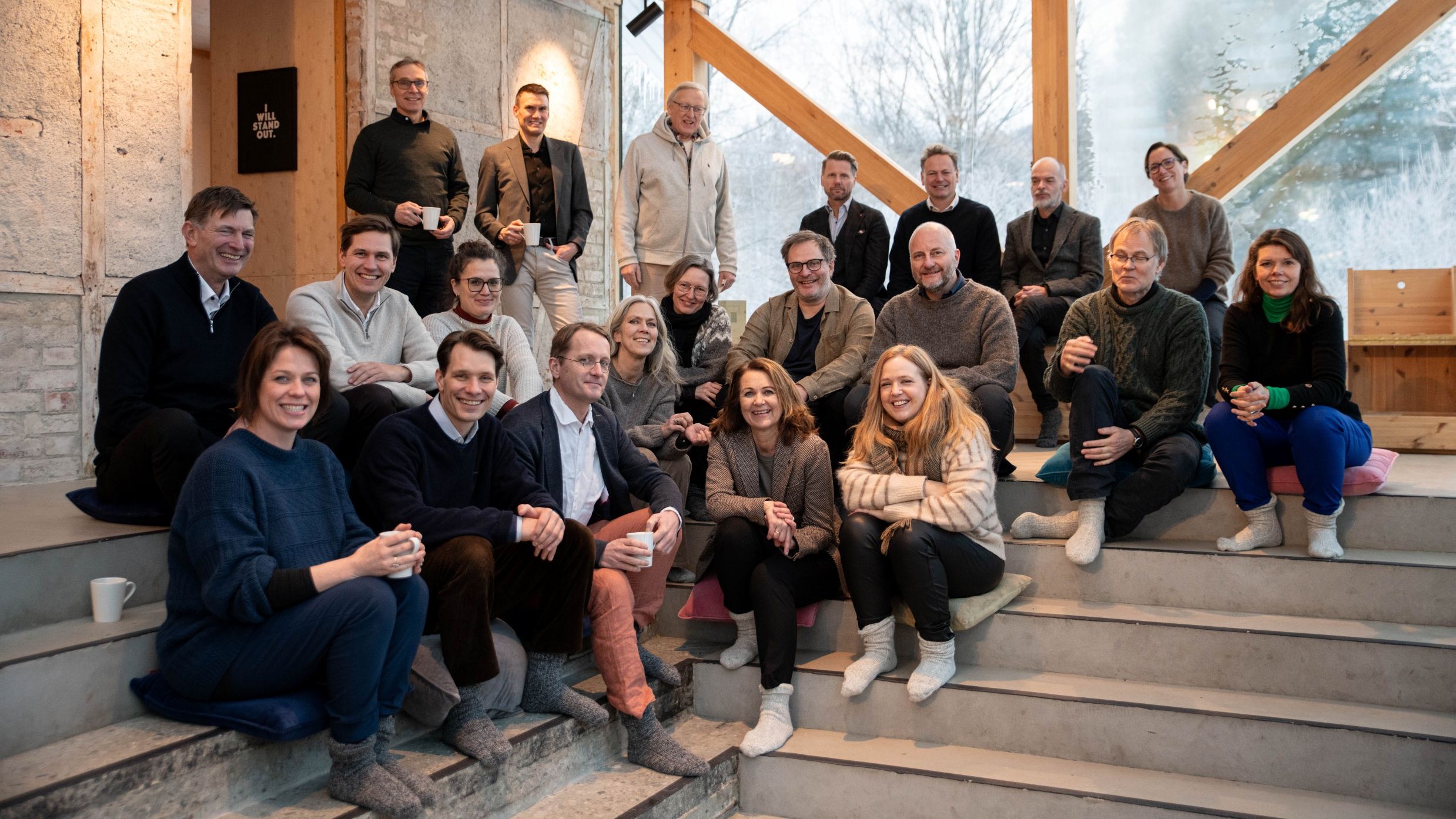 Group photo of seminar participants sitting on a stair
