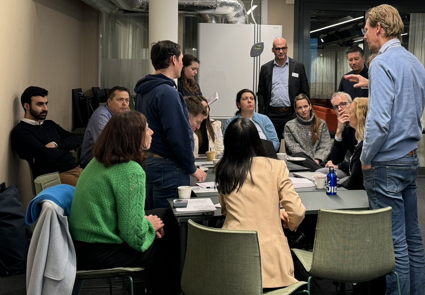 People gathered around a table doing group work