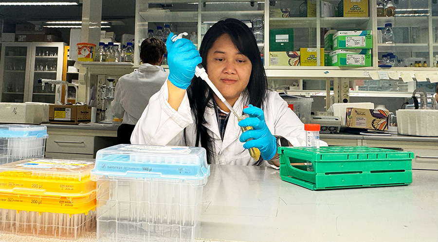 A woman doing an experiment in a laboratory