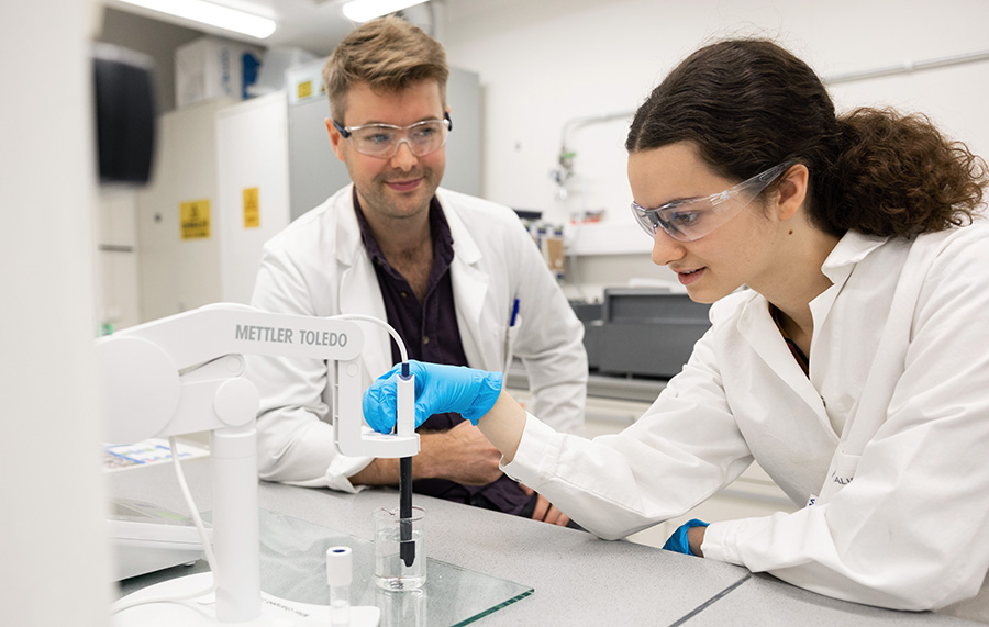 A woman and a man working together in the lab